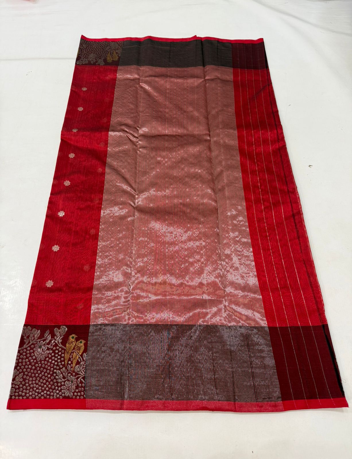 Chanderi handloom pattu silk saree featuring a dark maroon zari border with intricate gold bird motifs, styled with a matching blouse