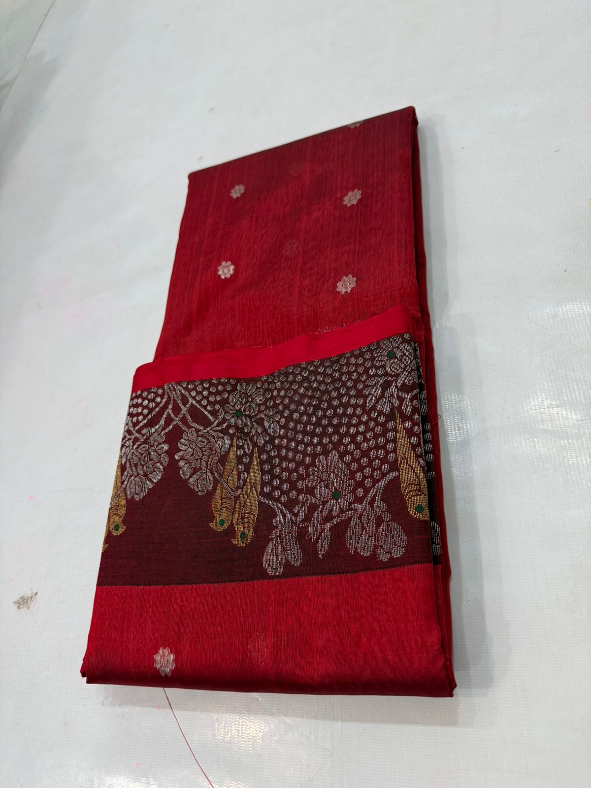 Chanderi handloom pattu silk saree featuring a dark maroon zari border with intricate gold bird motifs, styled with a matching blouse
