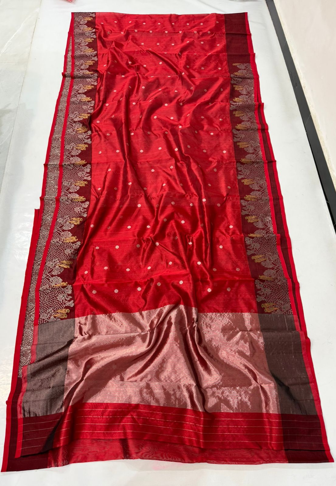 Chanderi handloom pattu silk saree featuring a dark maroon zari border with intricate gold bird motifs, styled with a matching blouse