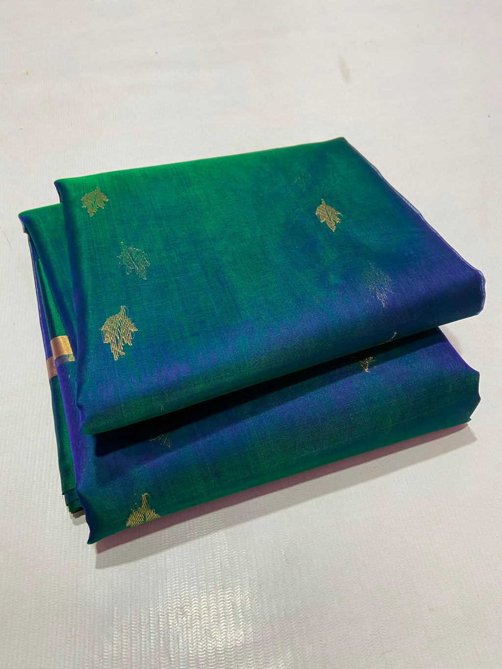 Dual Tone Peacock Blue Chanderi Handloom Katan Silk saree with gold zari motifs.