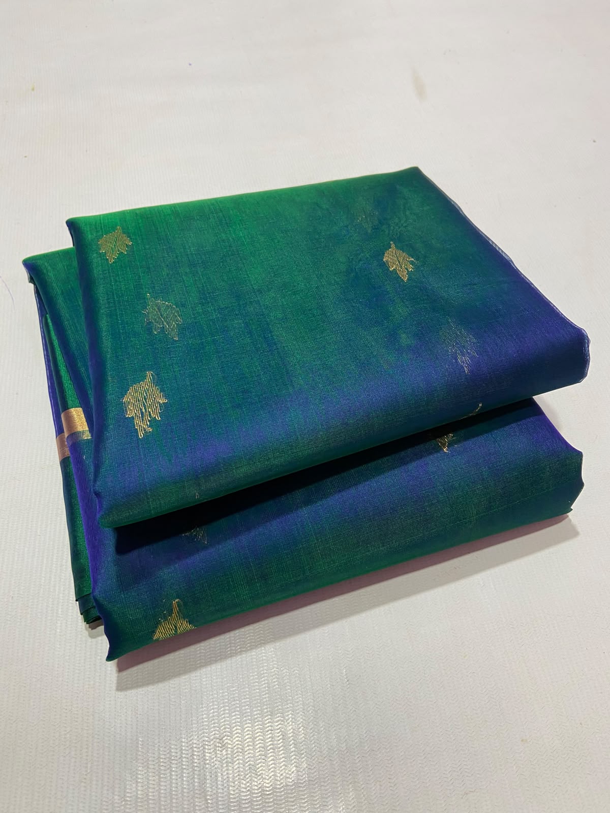 Dual Tone Peacock Blue Chanderi Handloom Katan Silk saree with gold zari motifs.