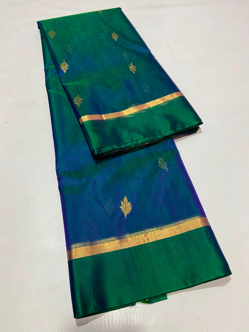 Dual Tone Peacock Blue Chanderi Handloom Katan Silk saree with gold zari motifs.
