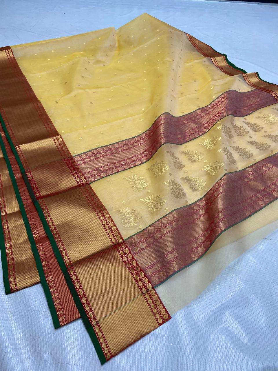 Pale Yellow Chanderi Handloom Katan Silk saree featuring intricate Nakshi borders and a detailed matching Nakshi pallu.