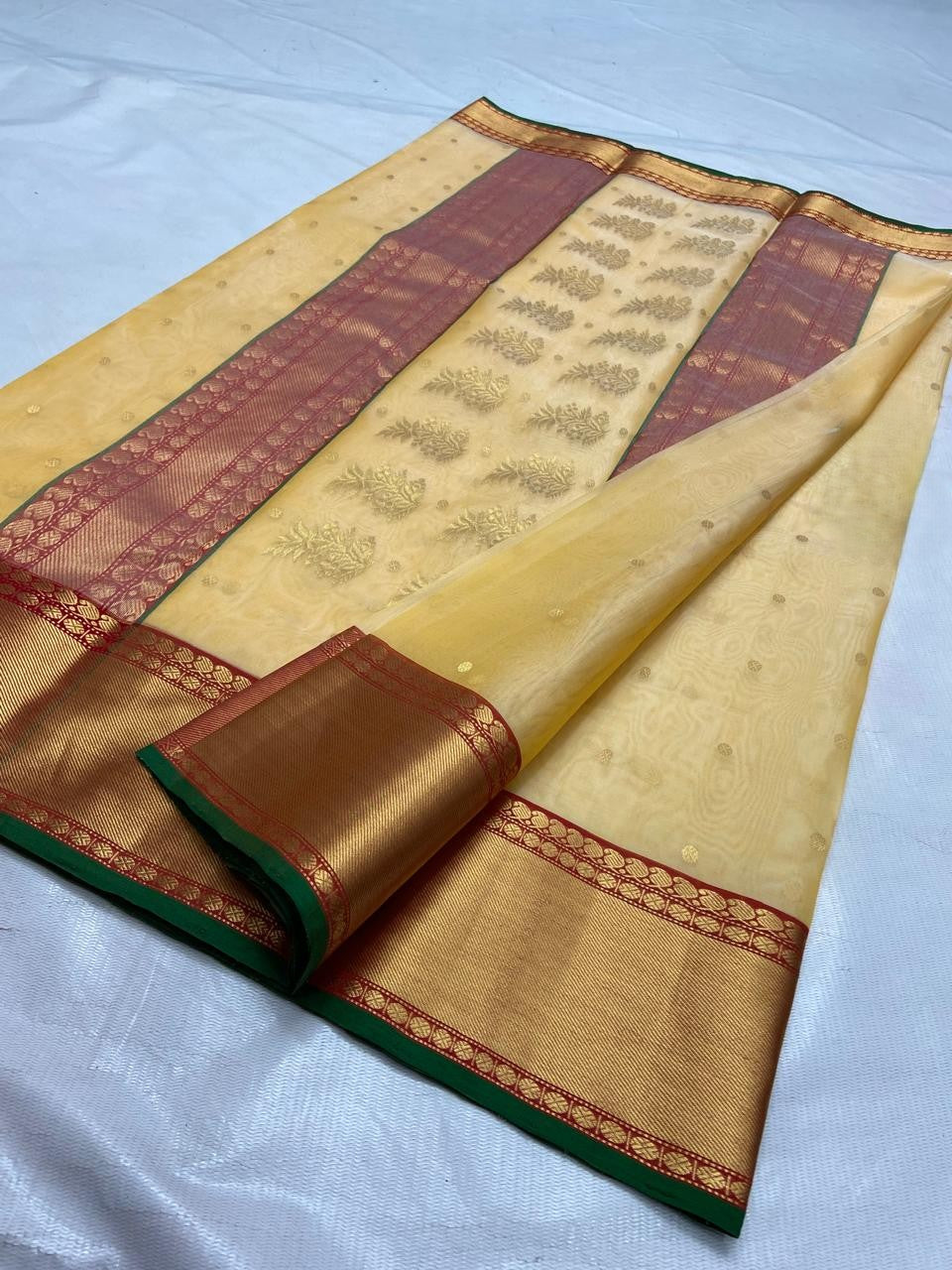 Pale Yellow Chanderi Handloom Katan Silk saree featuring intricate Nakshi borders and a detailed matching Nakshi pallu.