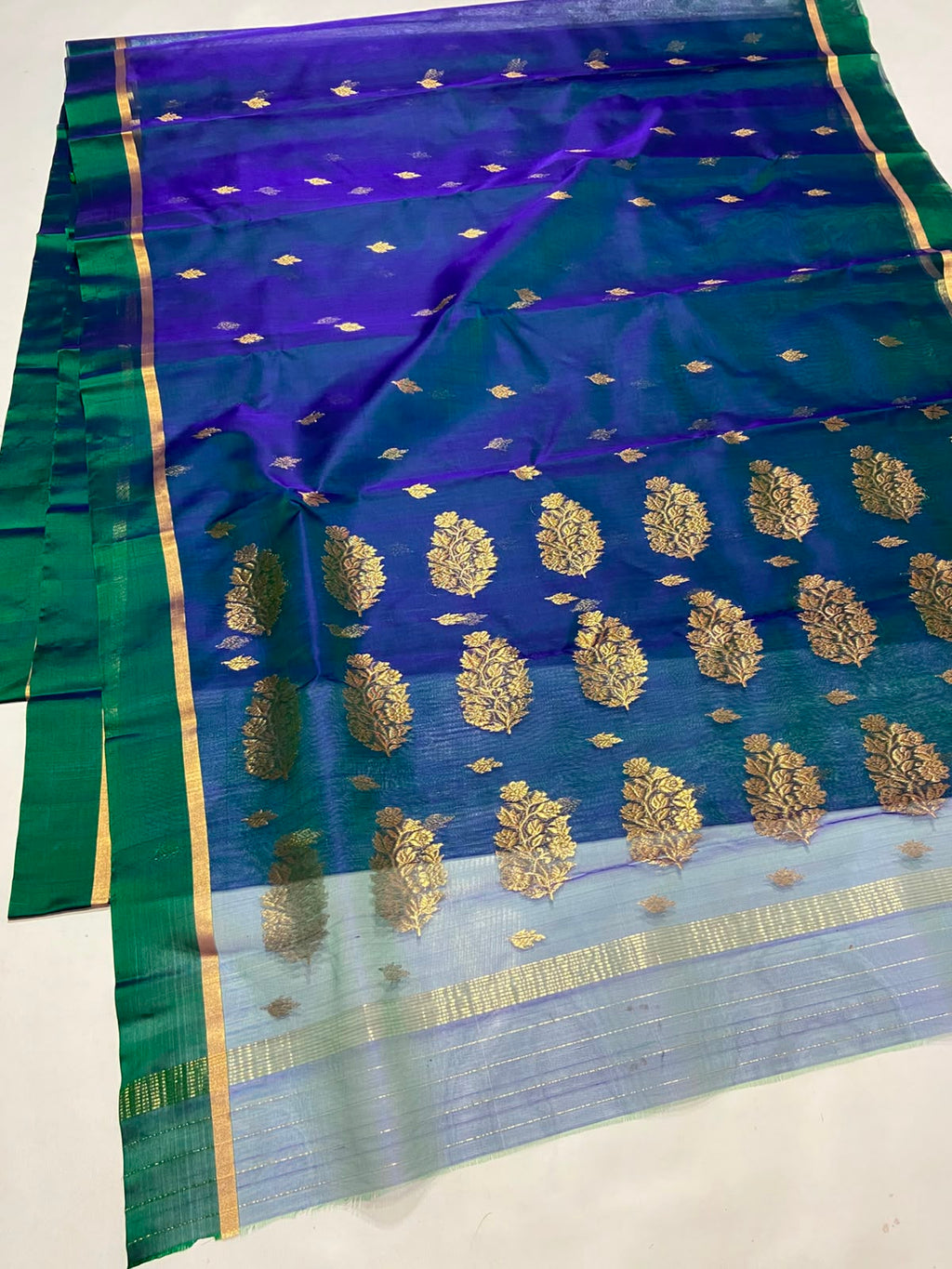 Dual Tone Peacock Blue Chanderi Handloom Katan Silk saree with gold zari motifs.