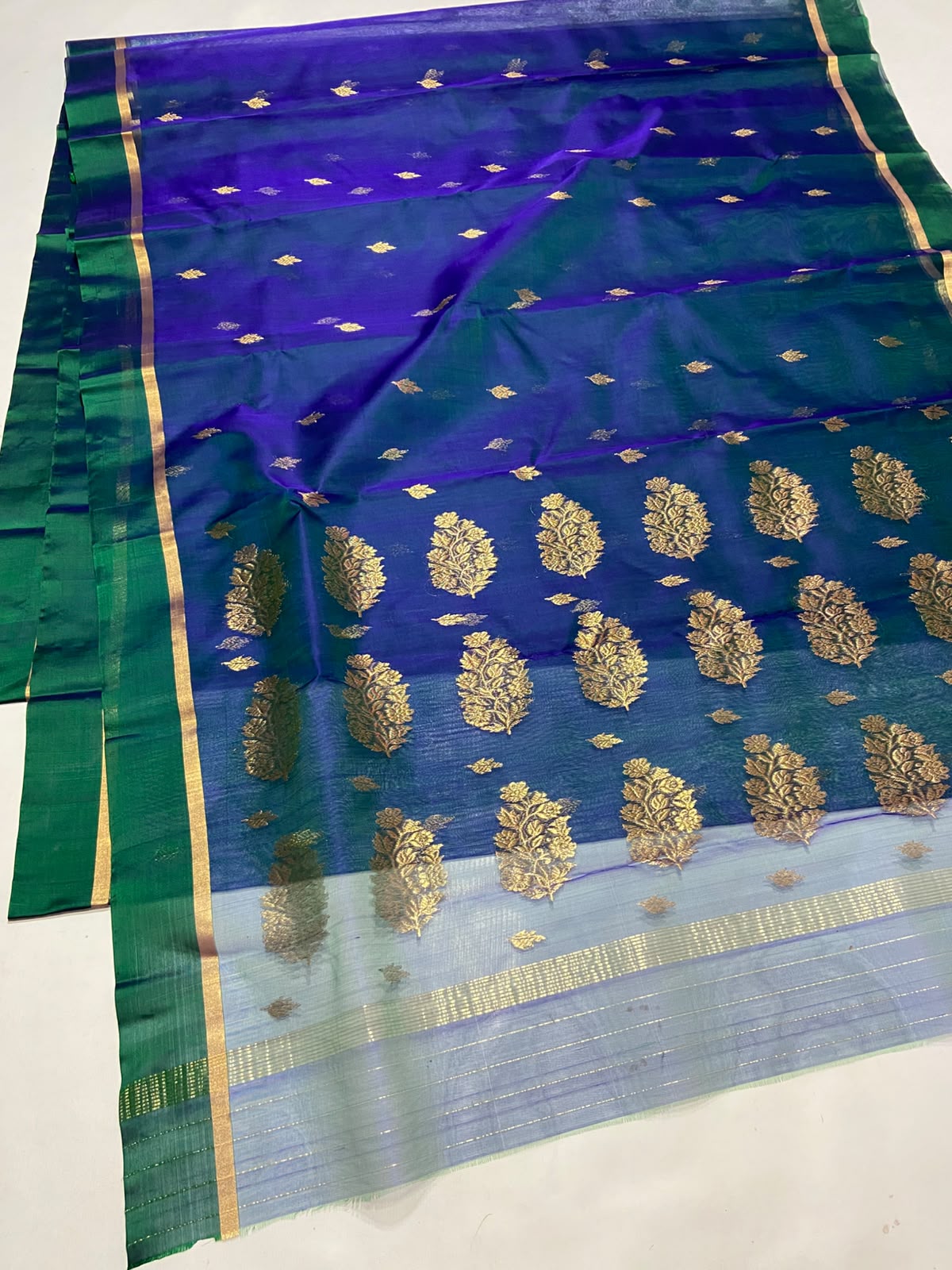 Dual Tone Peacock Blue Chanderi Handloom Katan Silk saree with gold zari motifs.
