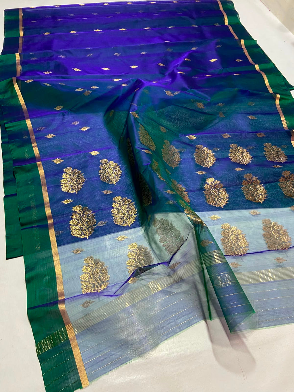 Dual Tone Peacock Blue Chanderi Handloom Katan Silk saree with gold zari motifs.