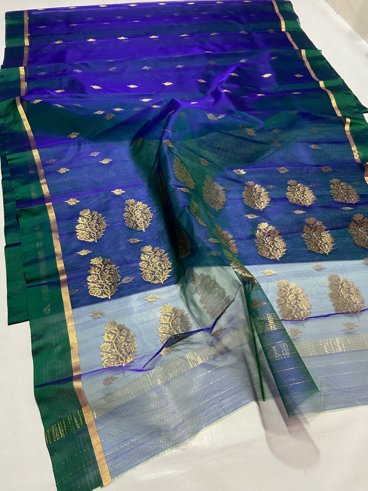 Dual Tone Peacock Blue Chanderi Handloom Katan Silk saree with gold zari motifs.