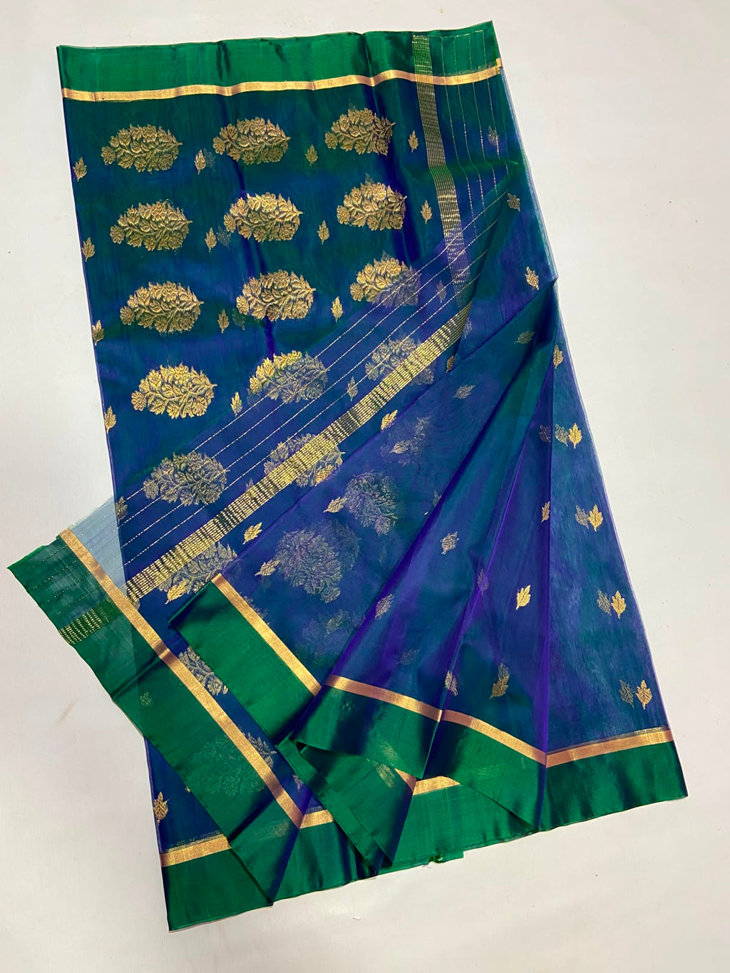Dual Tone Peacock Blue Chanderi Handloom Katan Silk saree with gold zari motifs.