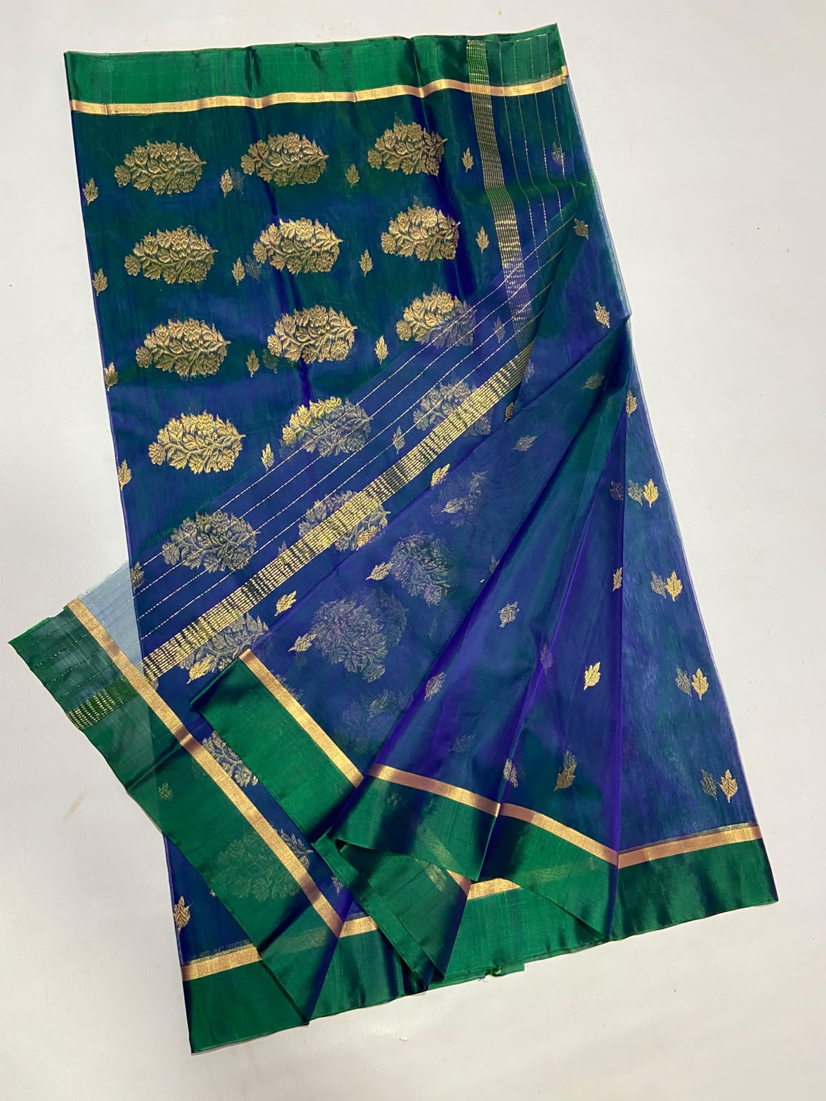 Dual Tone Peacock Blue Chanderi Handloom Katan Silk saree with gold zari motifs.