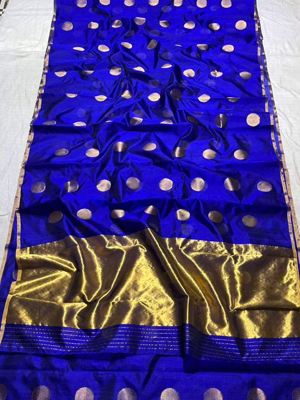 Vibrant Royal Blue Chanderi Handloom Pattu Silk saree featuring gold zari polka dot motifs and a rich gold border.
