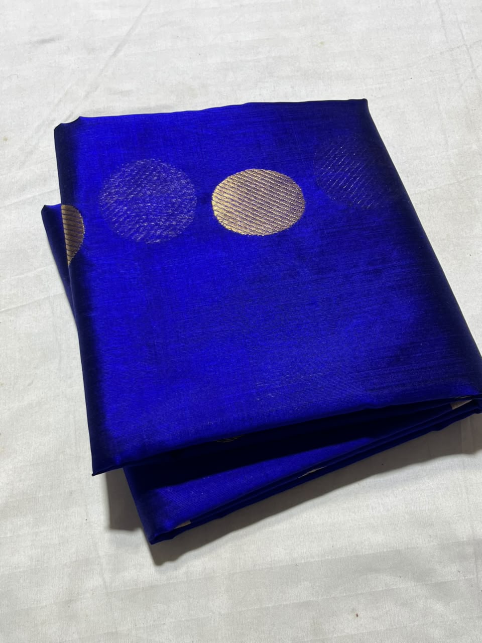 Vibrant Royal Blue Chanderi Handloom Pattu Silk saree featuring gold zari polka dot motifs and a rich gold border.