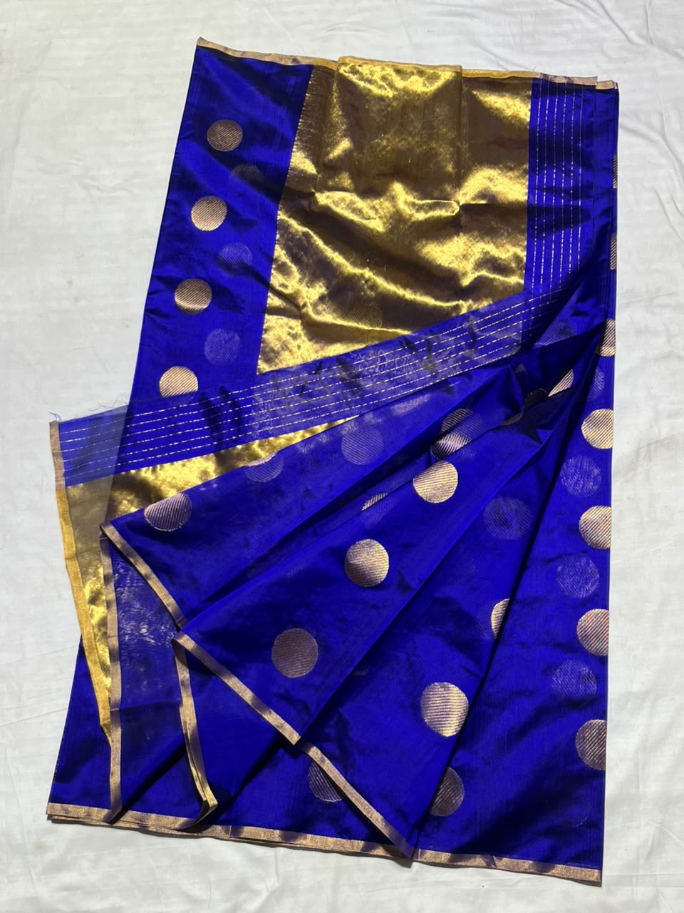 Vibrant Royal Blue Chanderi Handloom Pattu Silk saree featuring gold zari polka dot motifs and a rich gold border.