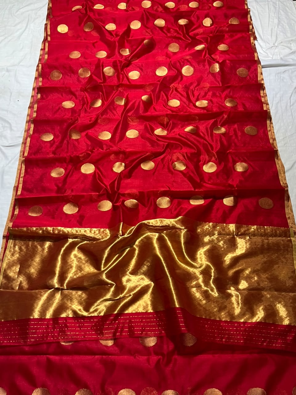 Deep Red Chanderi Handloom Pattu Silk saree with gold zari polka dot motifs and a rich golden border.