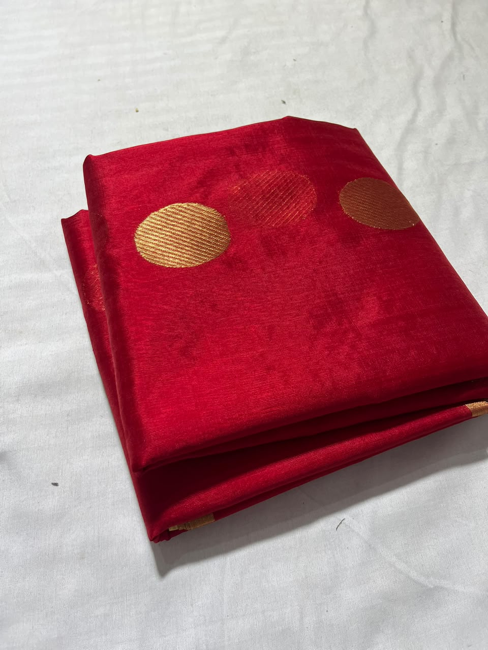 Deep Red Chanderi Handloom Pattu Silk saree with gold zari polka dot motifs and a rich golden border.
