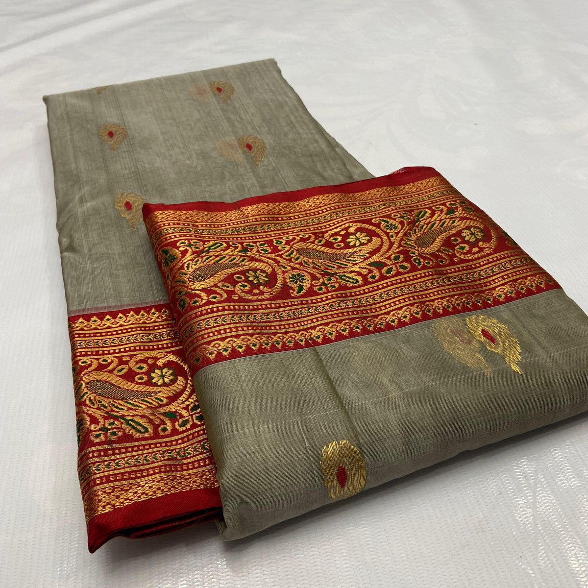 Grey Chanderi Handloom Katan Silk Meenakari Saree featuring gold zari bootis and a rich red border