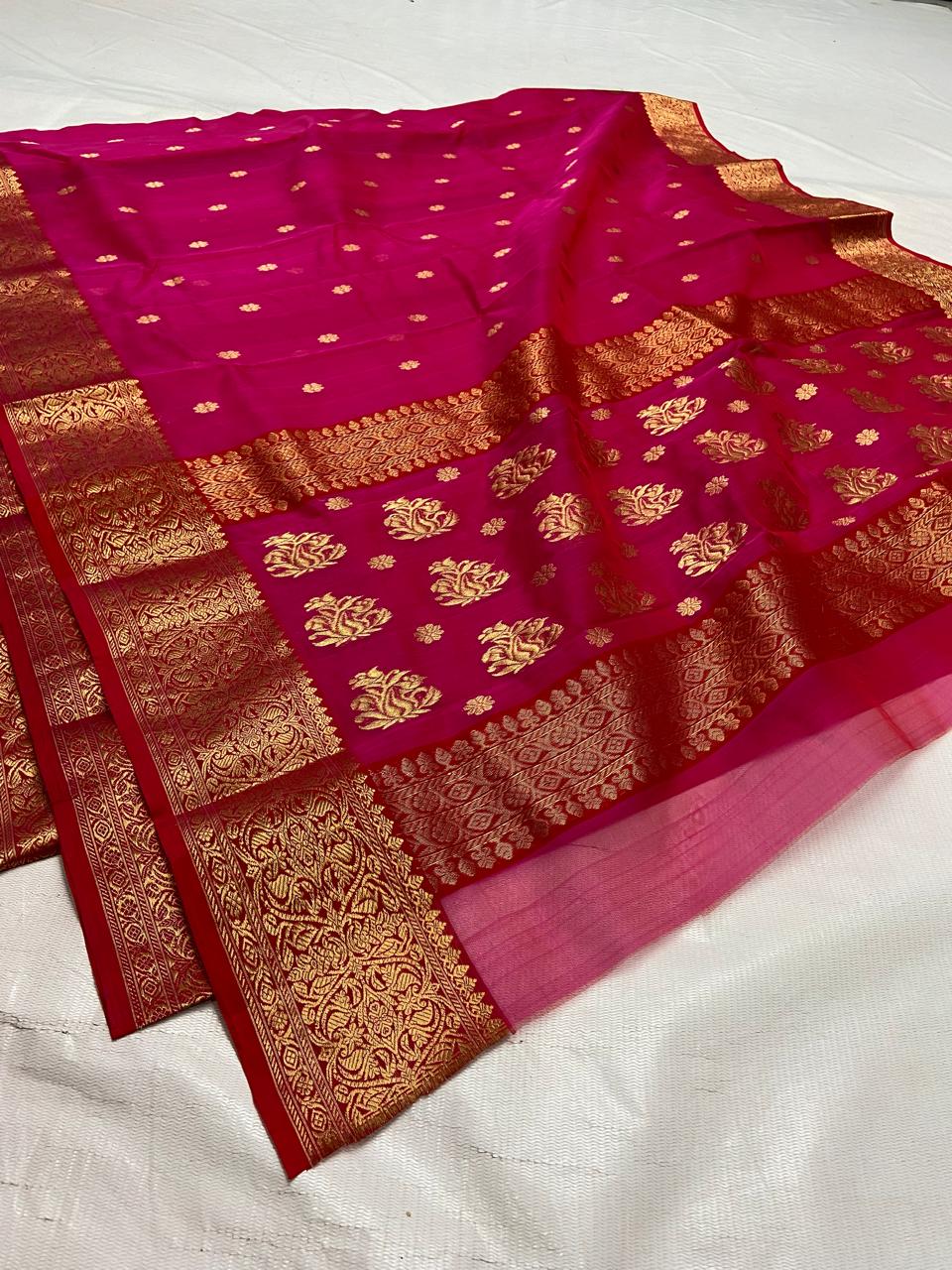Rani Pink Chanderi handloom Katan silk saree featuring intricate gold zari nakshi borders and elaborate paisley motifs on the pallu by Silk Tatva.