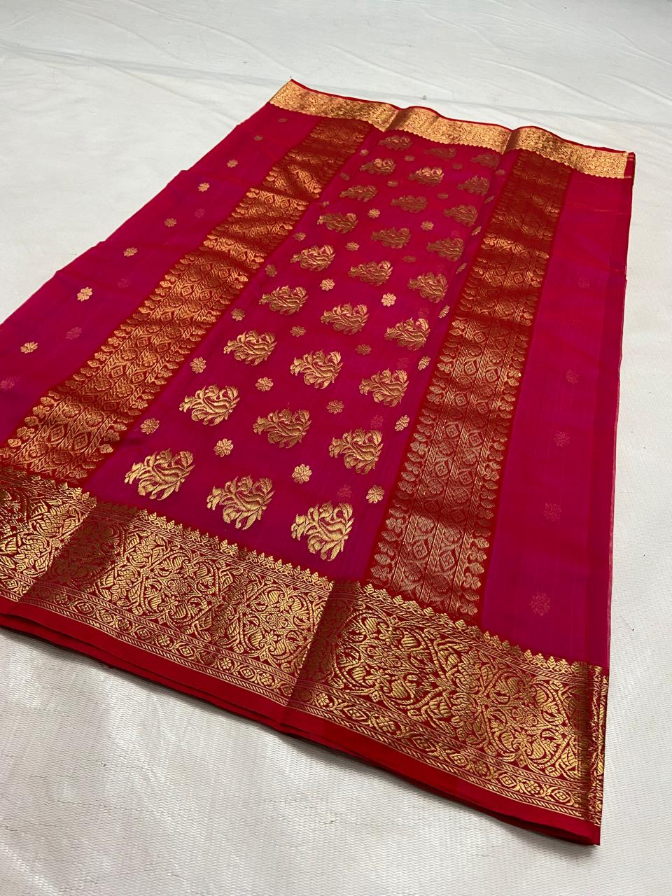 Rani Pink Chanderi handloom Katan silk saree featuring intricate gold zari nakshi borders and elaborate paisley motifs on the pallu by Silk Tatva.