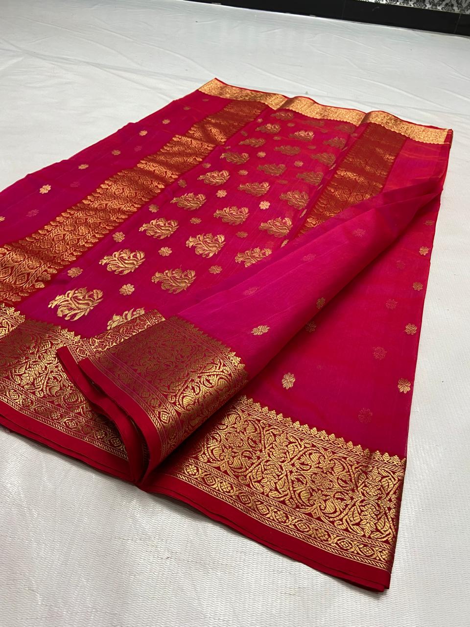 Rani Pink Chanderi handloom Katan silk saree featuring intricate gold zari nakshi borders and elaborate paisley motifs on the pallu by Silk Tatva.