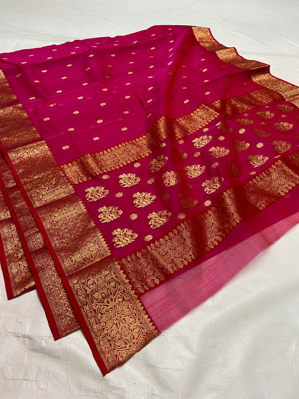 Rani Pink Chanderi handloom Katan silk saree featuring intricate gold zari nakshi borders and elaborate paisley motifs on the pallu by Silk Tatva.