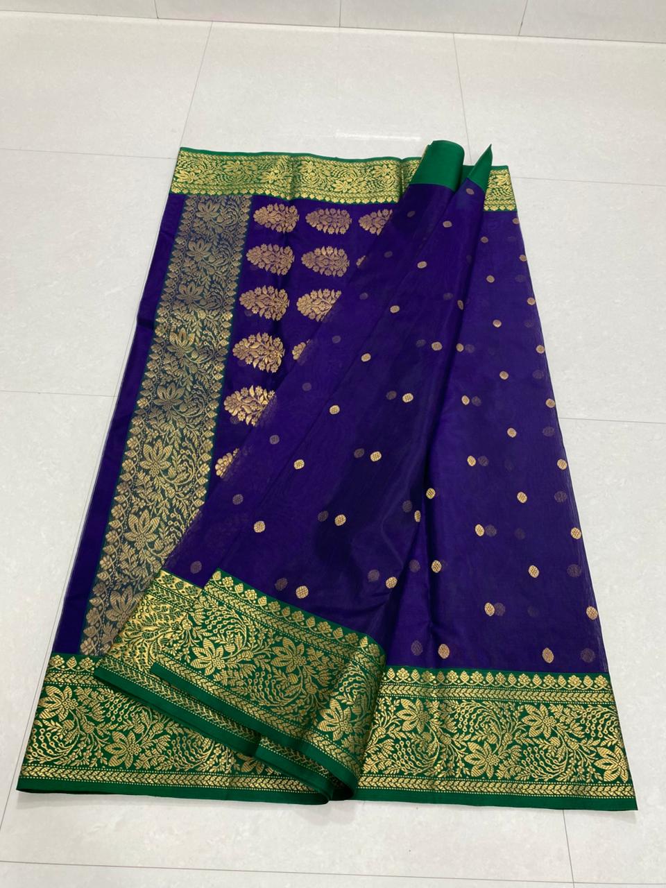 Dual tone purple Chanderi handloom Katan silk saree from Silk Tatva, featuring an intricate contrast green and gold zari floral pallu and border with matching buttas on a sheer body, as seen in Chanderi handloom Katan Silk Saree