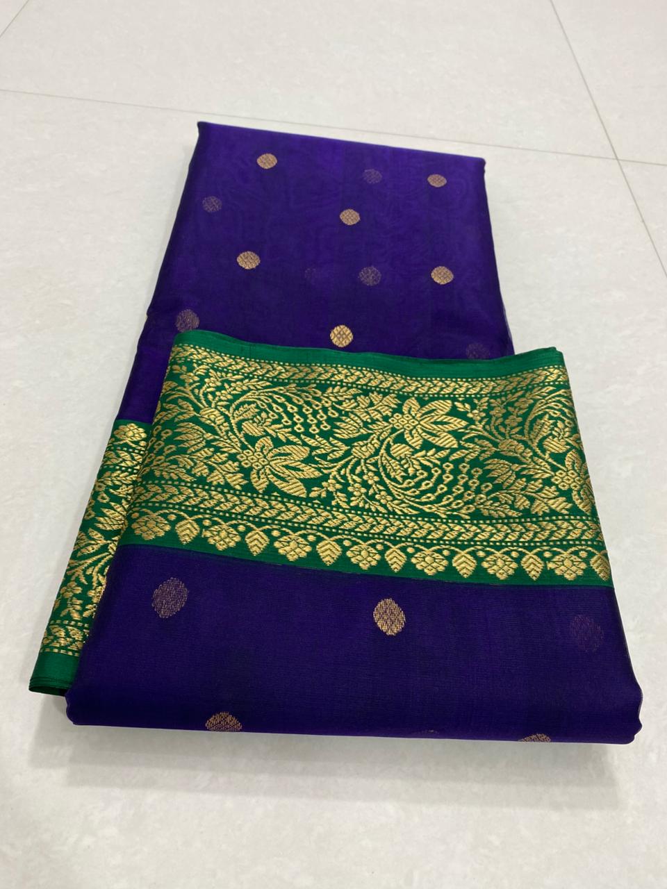 Dual tone purple Chanderi handloom Katan silk saree from Silk Tatva, featuring an intricate contrast green and gold zari floral pallu and border with matching buttas on a sheer body, as seen in Chanderi handloom Katan Silk Saree