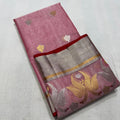 Delicate pink Chanderi handloom Katan silk saree featuring traditional sheer texture and intricate zari craftsmanship, draped beautifully.