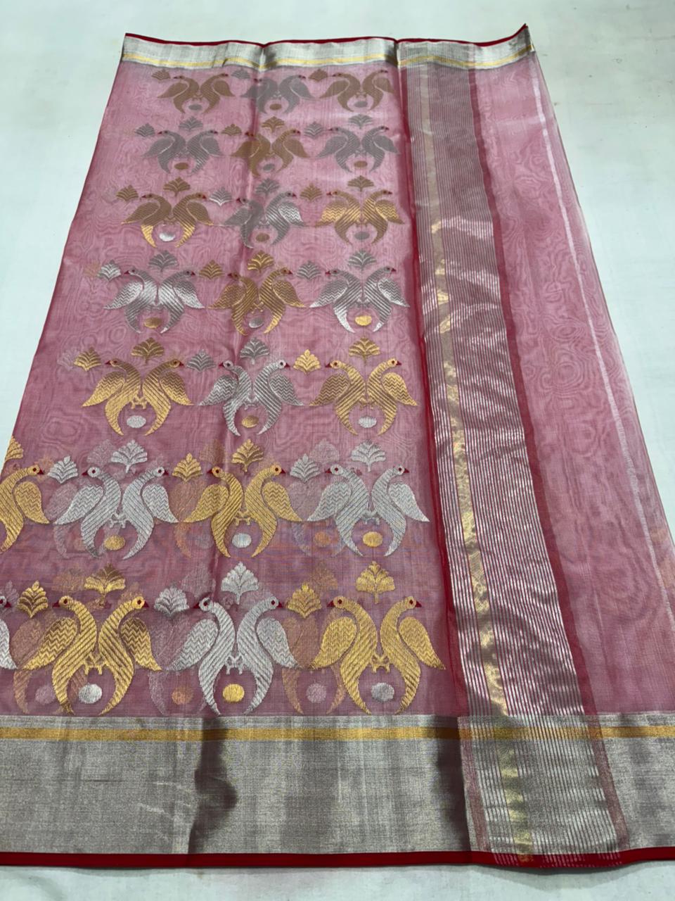 Delicate pink Chanderi handloom Katan silk saree featuring traditional sheer texture and intricate zari craftsmanship, draped beautifully.