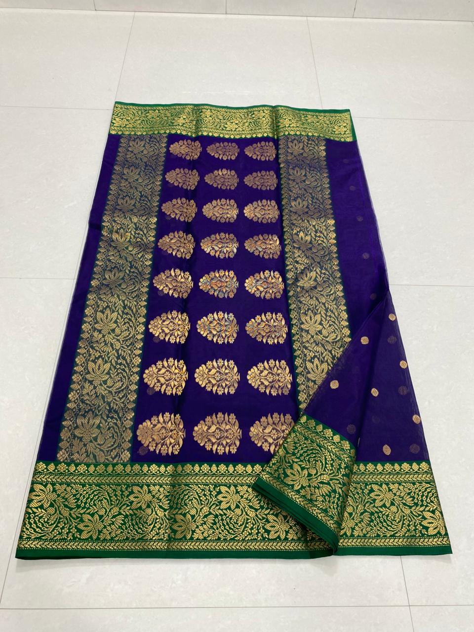 Dual tone purple Chanderi handloom Katan silk saree from Silk Tatva, featuring an intricate contrast green and gold zari floral pallu and border with matching buttas on a sheer body, as seen in Chanderi handloom Katan Silk Saree