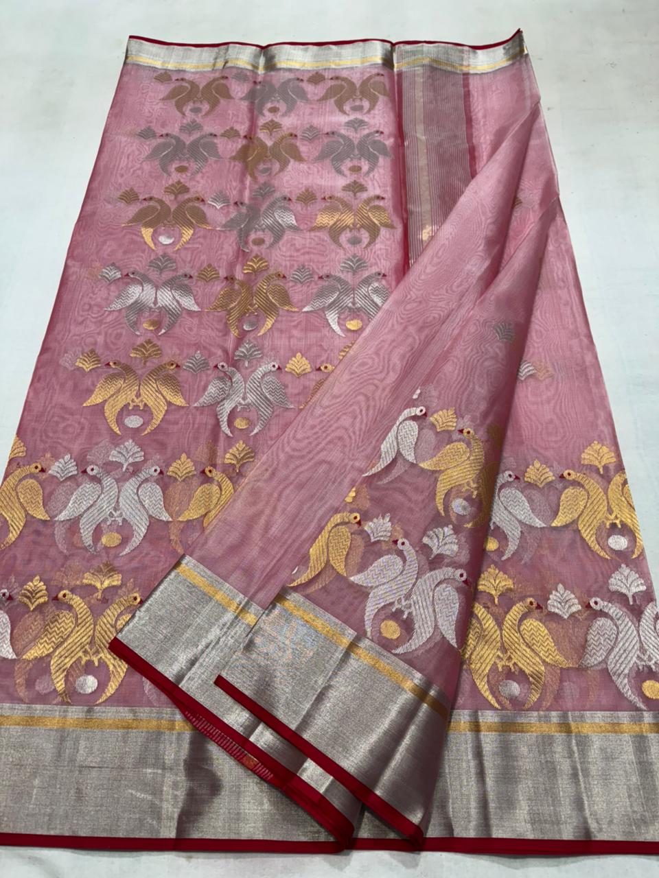 Delicate pink Chanderi handloom Katan silk saree featuring traditional sheer texture and intricate zari craftsmanship, draped beautifully.