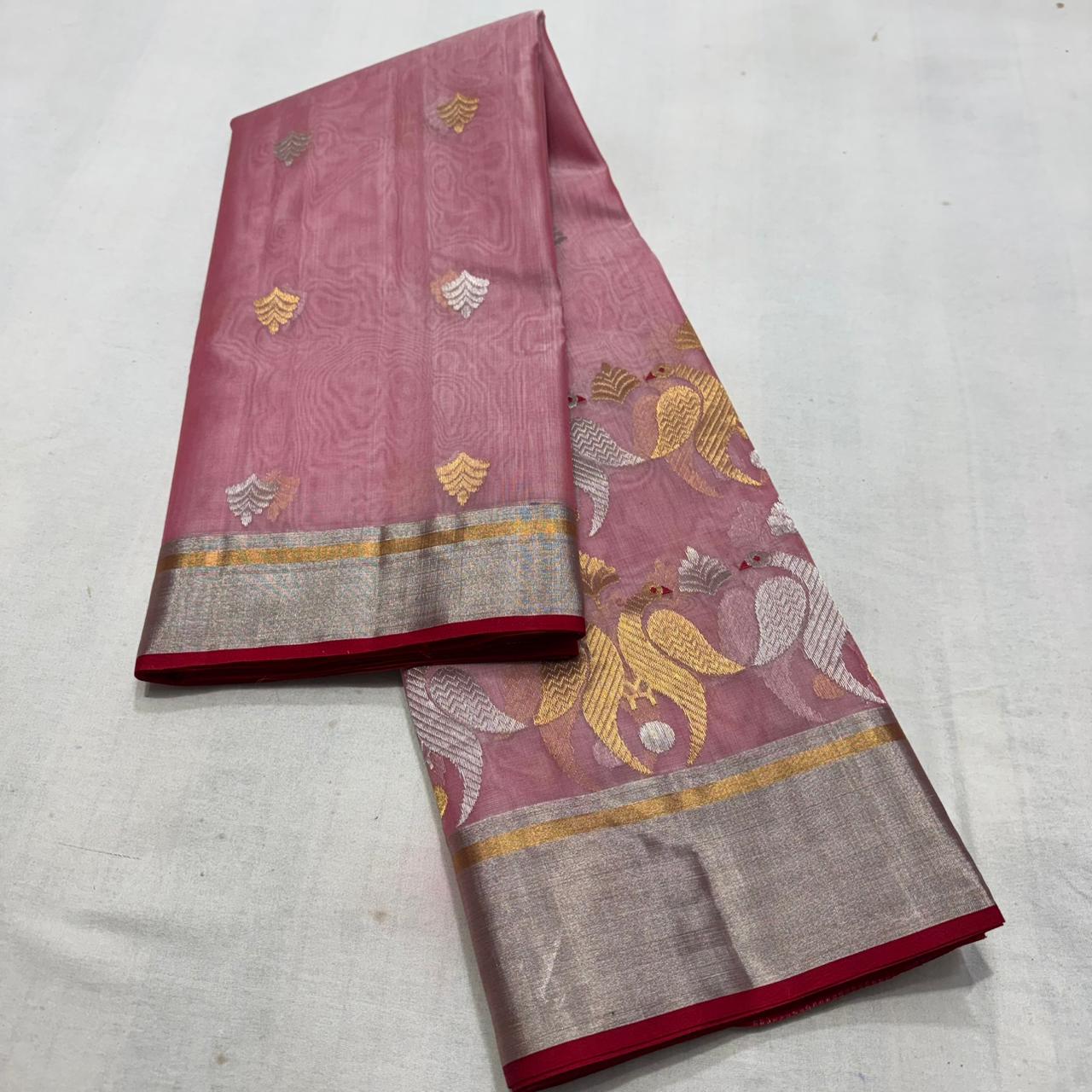Delicate pink Chanderi handloom Katan silk saree featuring traditional sheer texture and intricate zari craftsmanship, draped beautifully.