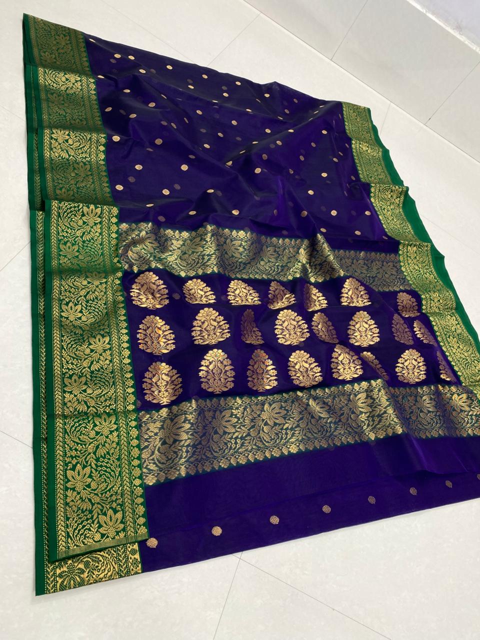 Dual tone purple Chanderi handloom Katan silk saree from Silk Tatva, featuring an intricate contrast green and gold zari floral pallu and border with matching buttas on a sheer body, as seen in Chanderi handloom Katan Silk Saree