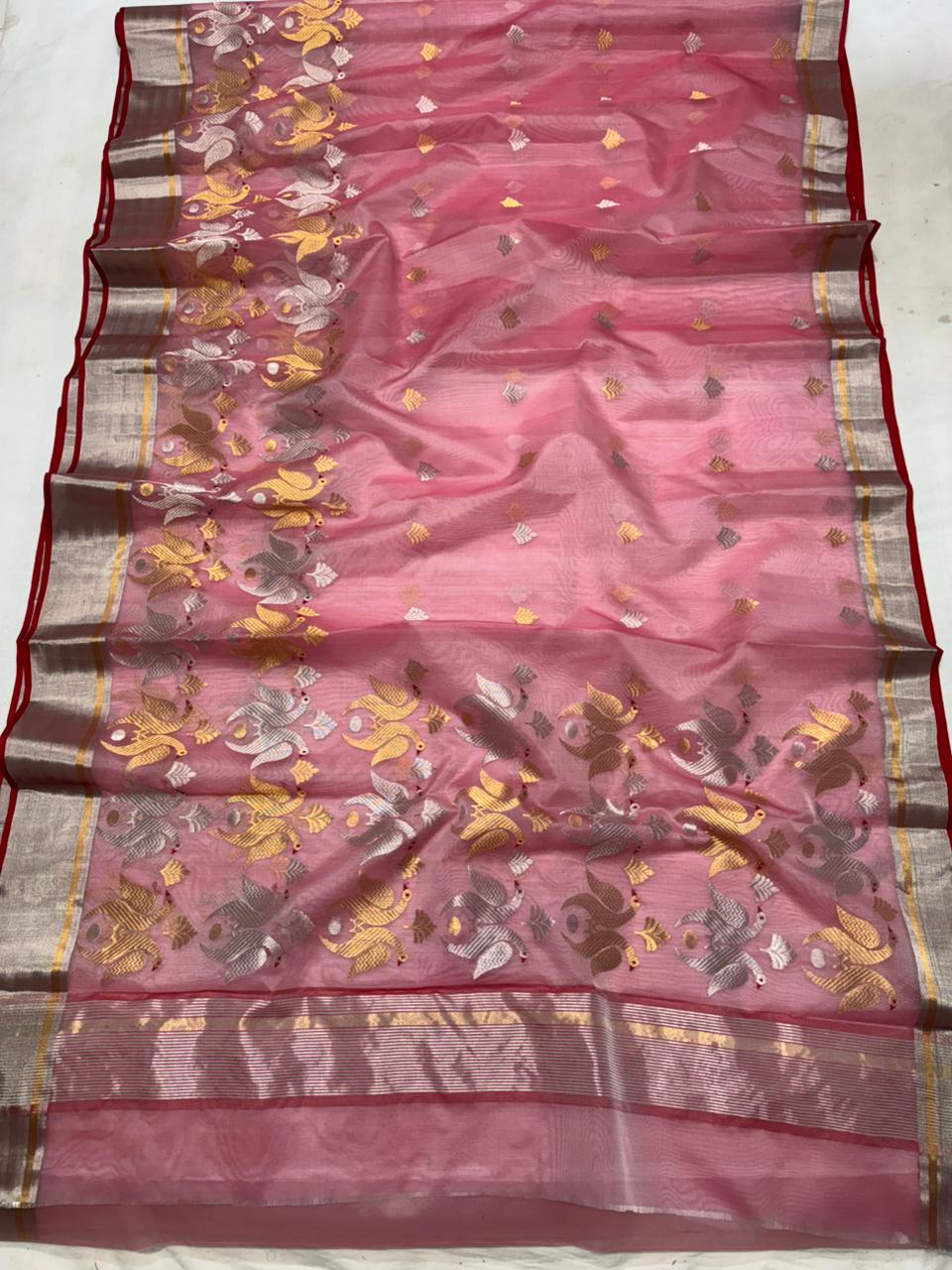 Delicate pink Chanderi handloom Katan silk saree featuring traditional sheer texture and intricate zari craftsmanship, draped beautifully.