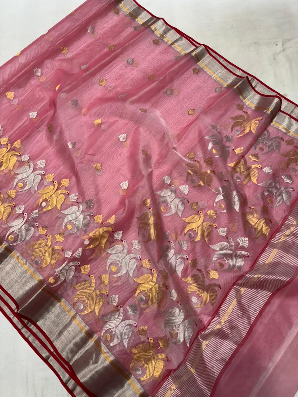 Delicate pink Chanderi handloom Katan silk saree featuring traditional sheer texture and intricate zari craftsmanship, draped beautifully.