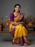 A model wearing a vibrant Gadwal Semi Pattu silk saree with intricate zari borders and a contrasting pallu.
