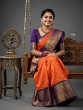 A model wearing a vibrant Gadwal Semi Pattu silk saree with intricate zari borders and a contrasting pallu.