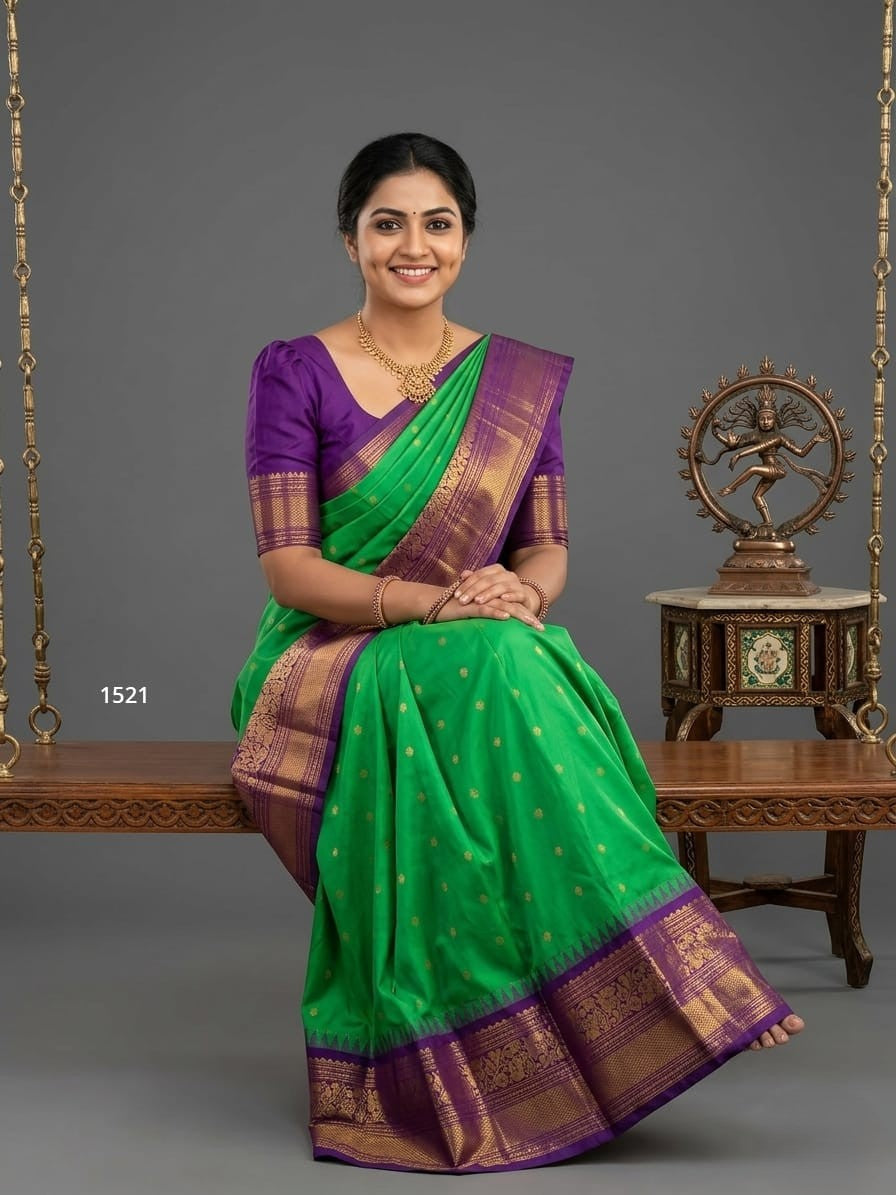 A model wearing a vibrant Gadwal Semi Pattu silk saree with intricate zari borders and a contrasting pallu.