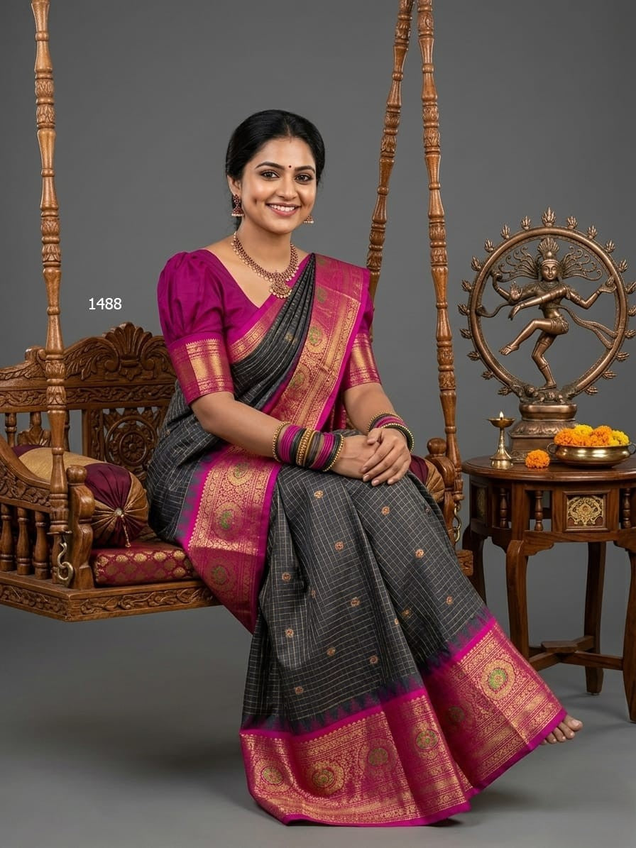A model wearing a vibrant Gadwal Semi Pattu silk saree with intricate zari borders and a contrasting pallu.