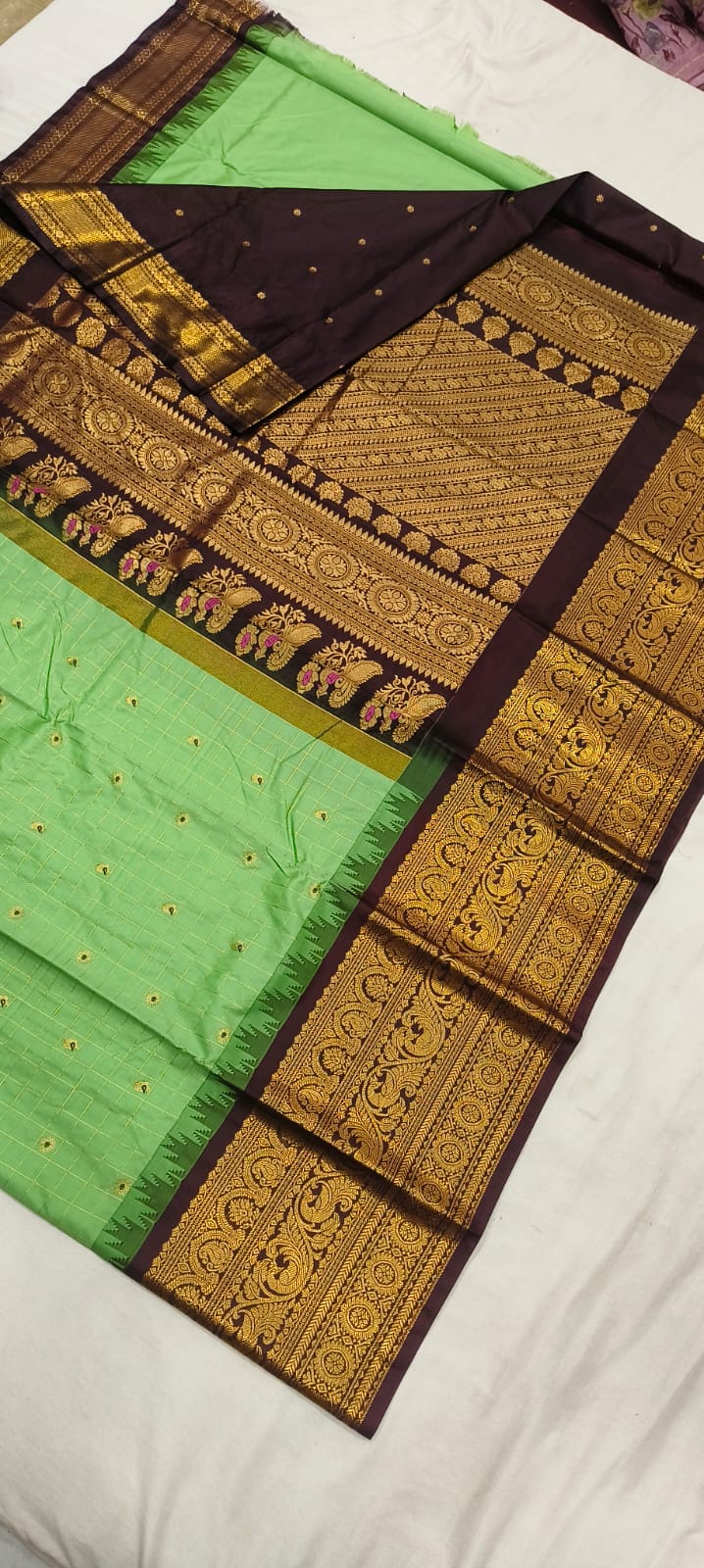 Elegant Gadwal semi Pattu silk saree draped to showcase its rich pallu and contrasting color combination