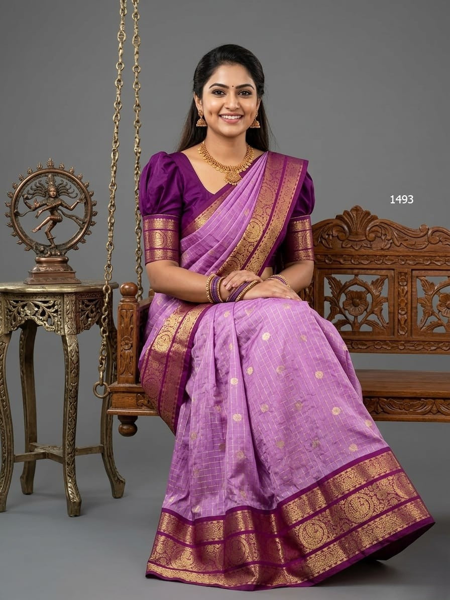 A model wearing a vibrant Gadwal Semi Pattu silk saree with intricate zari borders and a contrasting pallu.
