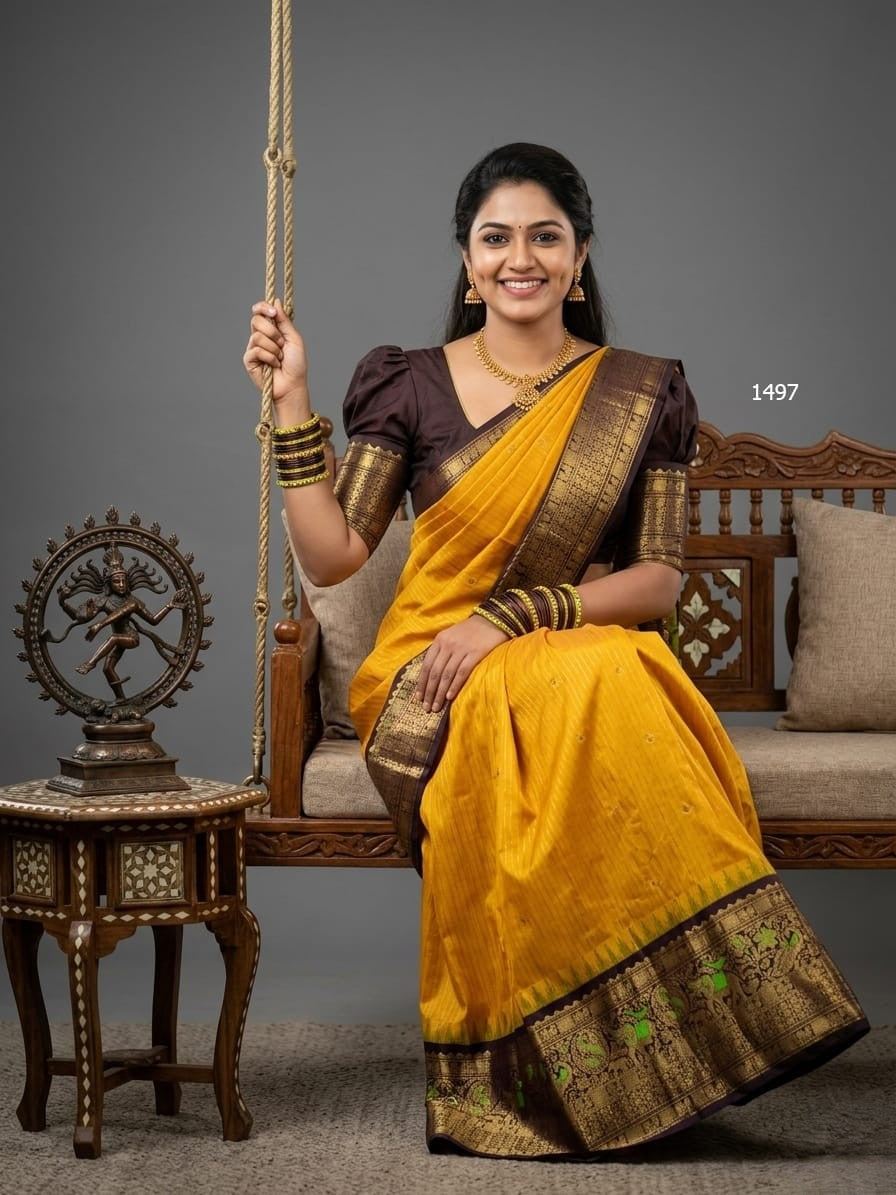 A model wearing a vibrant Gadwal Semi Pattu silk saree with intricate zari borders and a contrasting pallu.