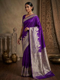 A royal purple Banarasi Katan silk saree with a silver and gold zari Kashi Ghat temple motif border and a Silk Mark Certification tag.