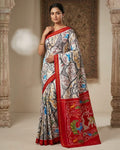 Red Pochampally Handloom Ikat Madthasu Patola Silk Saree featuring traditional double warp Ikat motifs, figurative panels, and a rich red pallu.