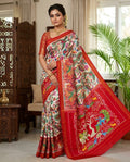 Red Pochampally Handloom Ikat Madthasu Patola Silk Saree featuring traditional double warp Ikat motifs, figurative panels, and a rich red pallu.