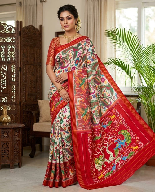 Red Pochampally Handloom Ikat Madthasu Patola Silk Saree featuring traditional double warp Ikat motifs, figurative panels, and a rich red pallu.