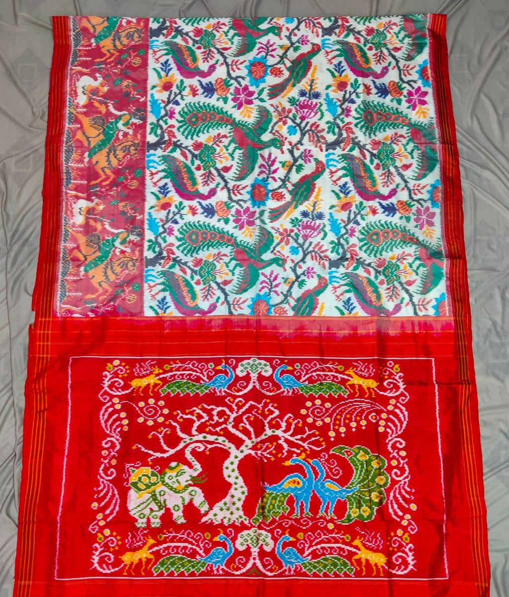 Red Pochampally Handloom Ikat Madthasu Patola Silk Saree featuring traditional double warp Ikat motifs, figurative panels, and a rich red pallu.
