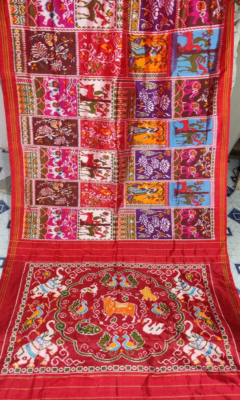 Red Pochampally Handloom Ikat Madthasu Patola Silk Saree featuring traditional double warp Ikat motifs, figurative panels, and a rich red pallu.
