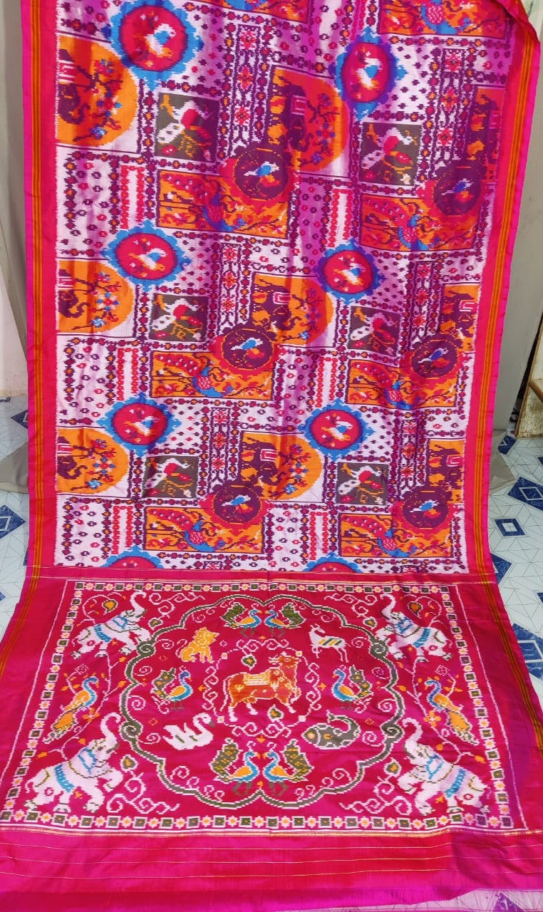 Red Pochampally Handloom Ikat Madthasu Patola Silk Saree featuring traditional double warp Ikat motifs, figurative panels, and a rich red pallu.