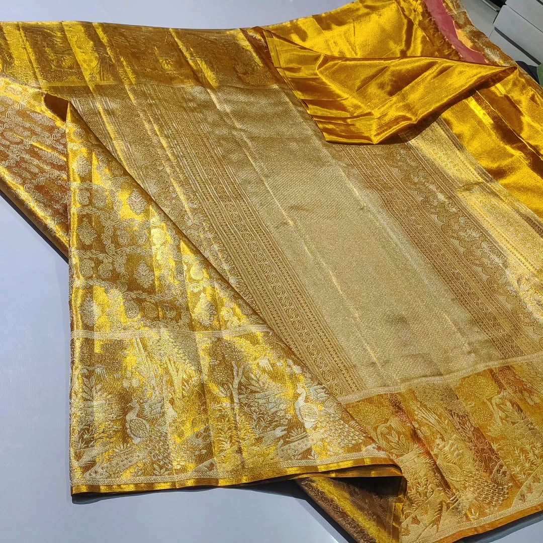 Gold Kanchipuram Handloom Tissue Brocade Silk Saree, a garment that defines the "liquid gold" look of South Indian royalty. 