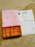 A radiant pink Kanchipuram handloom 4G pure gold korvai silk saree showcasing traditional contrasting borders and a lustrous weave.